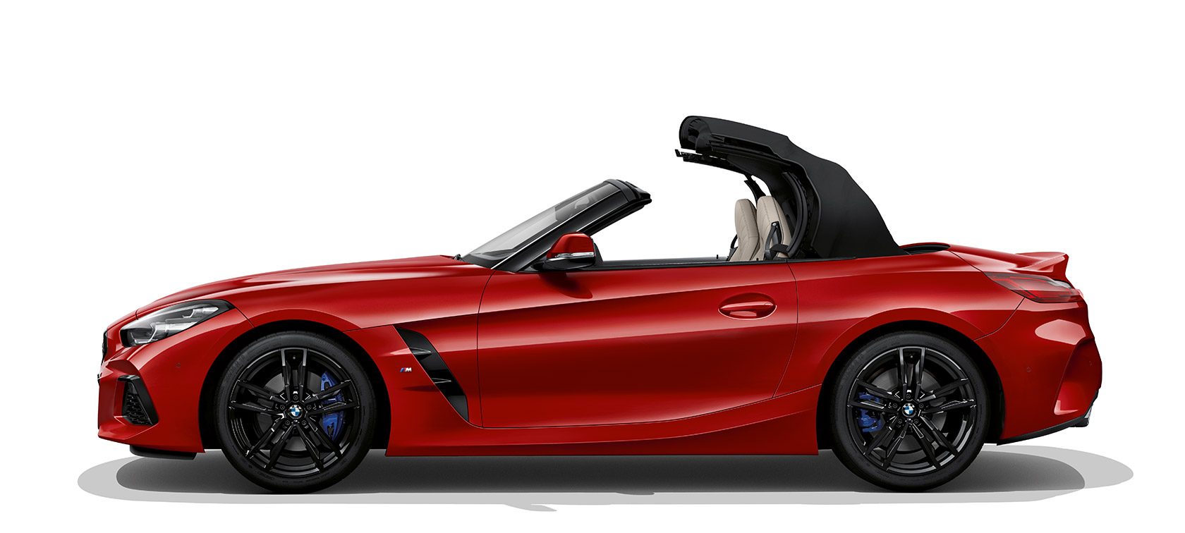 תצלום צידה של BMW Z4 רודסטר תצלום צידה של BMW Z4 רודסטר, כשהגג נפתח